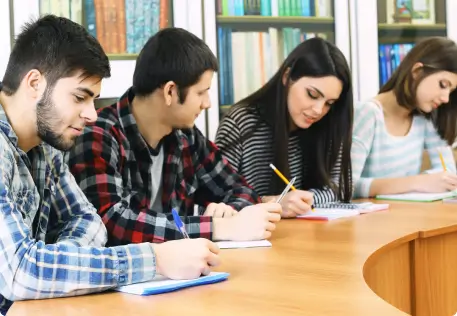 group-students-sitting-table-library